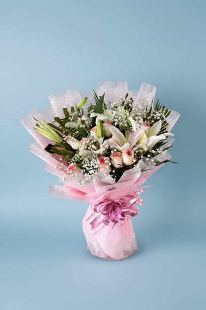 Premium white lily and white rose bouquet available for gift delivery across Kathmandu and Nepal.