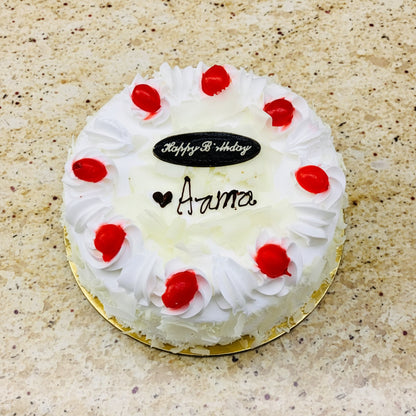 Elegant White Forest Cake decorated with white chocolate and cherries available for online cake delivery in Kathmandu.